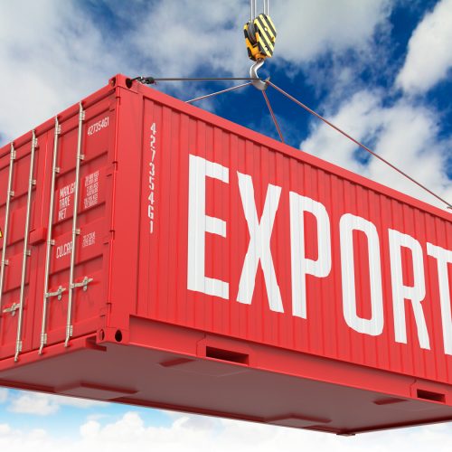Export - Red Cargo Container hoisted with hook on Blue Sky Background.